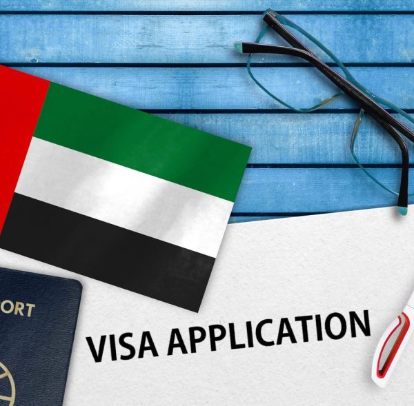Visa application form and flag of United Arab Emirates