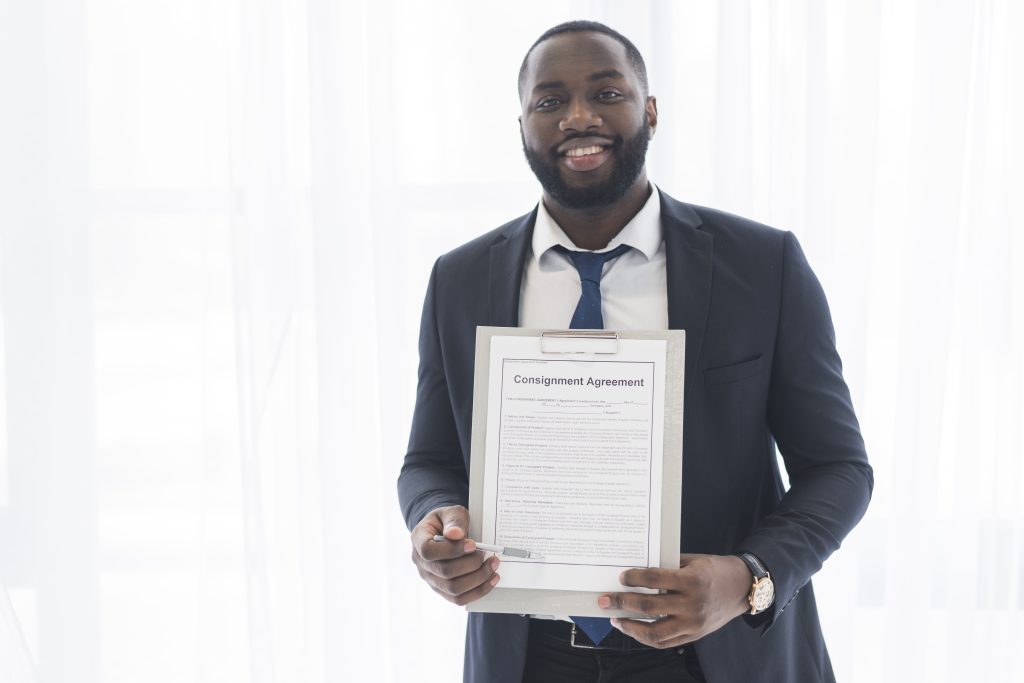 Business owner holding a signed contract