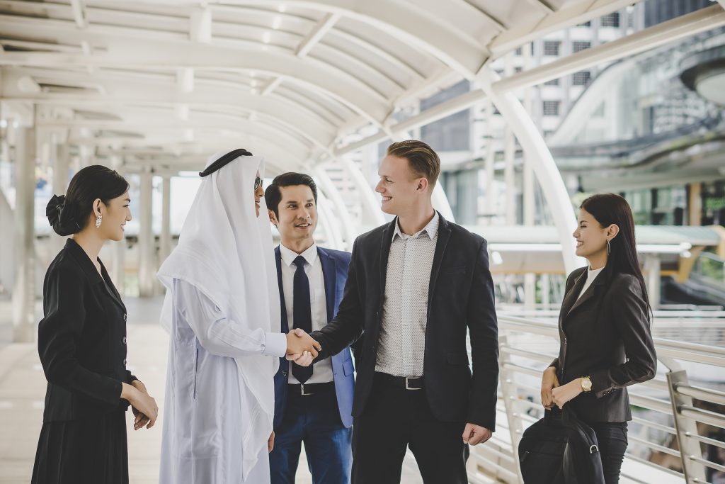 Business partners greeting each other in Dubai