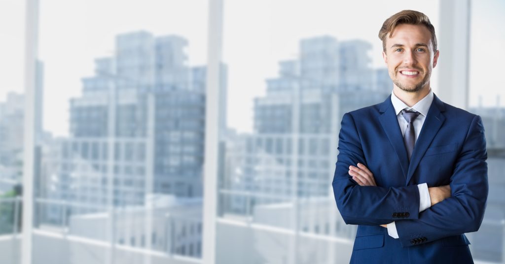 Professional in front of a high-rise city view